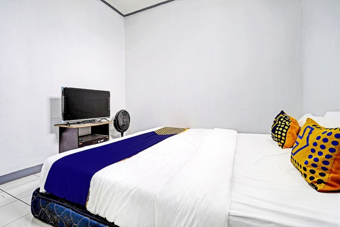 Imagen de la habitación del Hotel OYO 92512 Atlanta Guesthouse. Foto 4