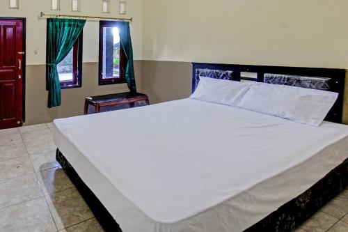 Imagen de la habitación del Hotel OYO 92624 Stone Homestay. Foto 20