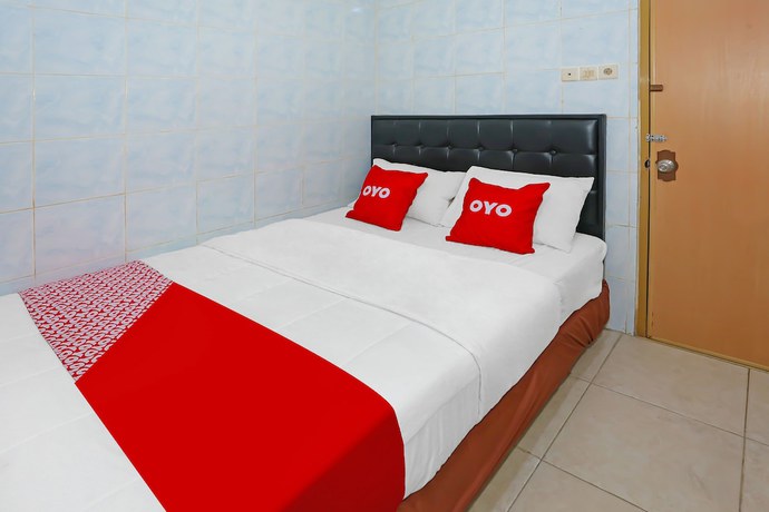 Imagen de la habitación del Hotel OYO 92677 Bintaro. Foto 13