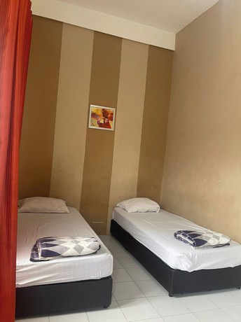 Imagen de la habitación del Hotel OYO 92696 Bahagia Homestay Syariah. Foto 9