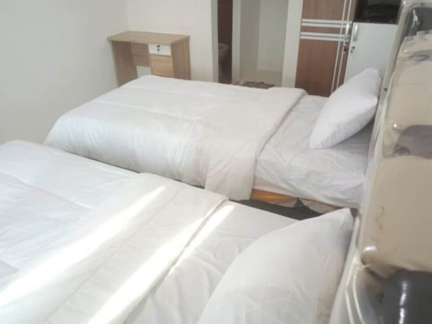 Imagen de la habitación del Hotel OYO 92696 Bahagia Homestay Syariah. Foto 12