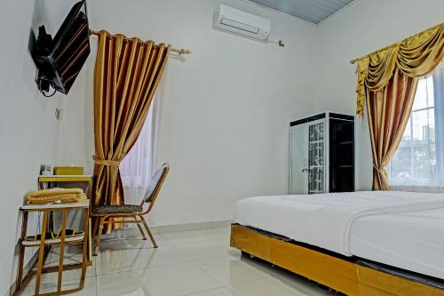 Imagen de la habitación del Hotel OYO 92708 Mufasa Syariah. Foto 20