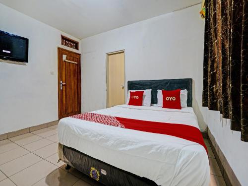 Imagen de la habitación del Hotel OYO 92726 Geulis Guest House. Foto 19