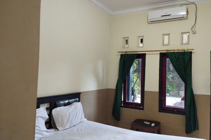 Imagen de la habitación del Hotel OYO 92756 Kos Moncok. Foto 2