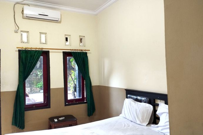 Imagen de la habitación del Hotel OYO 92756 Kos Moncok. Foto 3