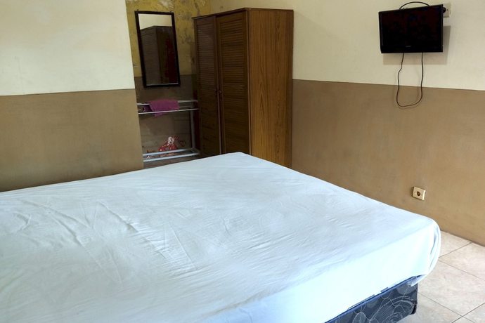 Imagen de la habitación del Hotel OYO 92756 Kos Moncok. Foto 7