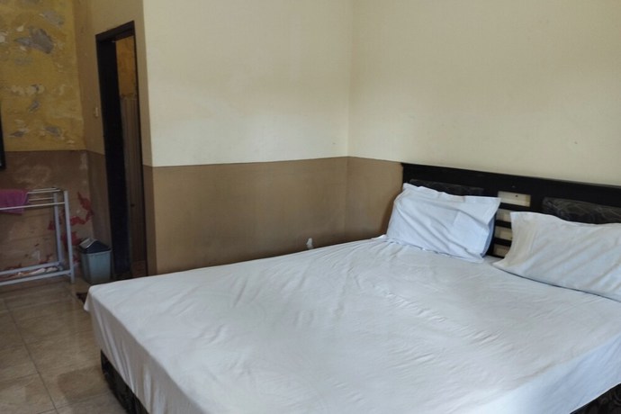 Imagen de la habitación del Hotel OYO 92756 Kos Moncok. Foto 9