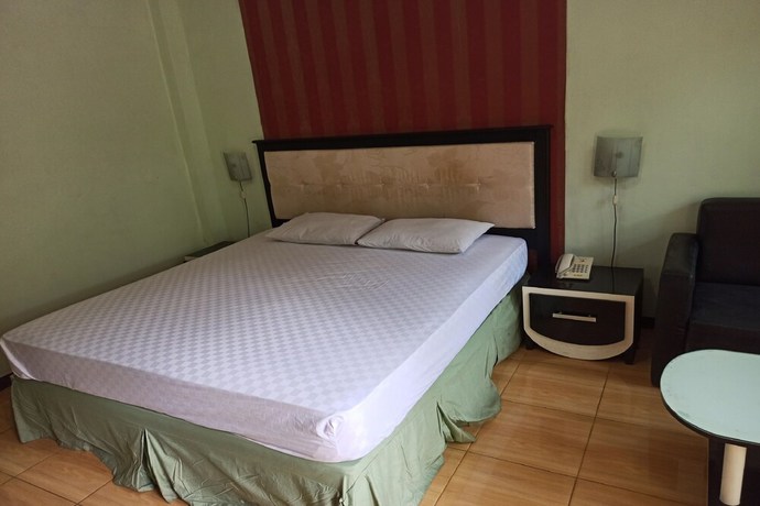Imagen de la habitación del Hotel OYO 92762 Wisma Pundu Syariah. Foto 7