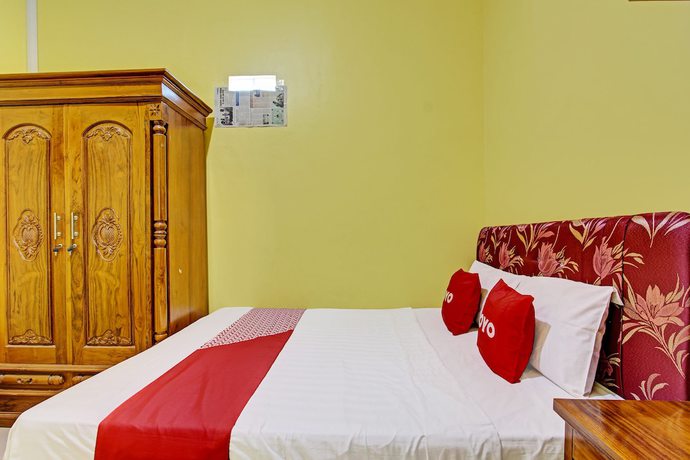 Imagen de la habitación del Hotel OYO 92792 Umi Rahayu Guesthouse. Foto 6