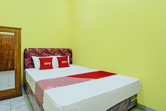 Imagen de la habitación del Hotel OYO 92792 Umi Rahayu Guesthouse. Foto 10