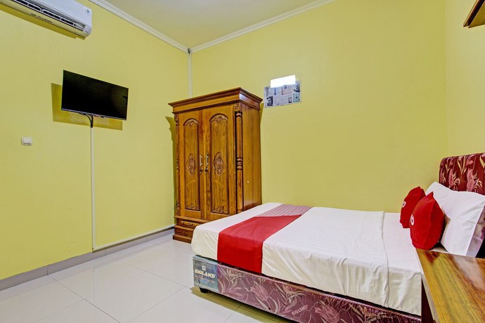 Imagen de la habitación del Hotel OYO 92792 Umi Rahayu Guesthouse. Foto 14