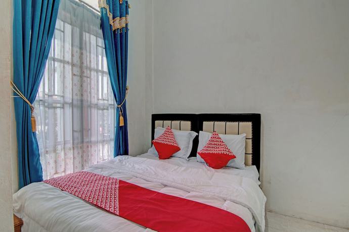 Imagen de la habitación del Hotel OYO 92818 Penginapan Garuda Syariah. Foto 6