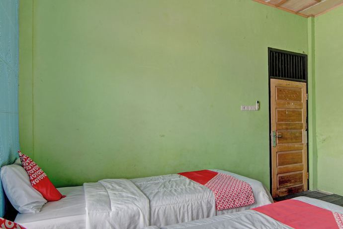 Imagen de la habitación del Hotel OYO 92818 Penginapan Garuda Syariah. Foto 9