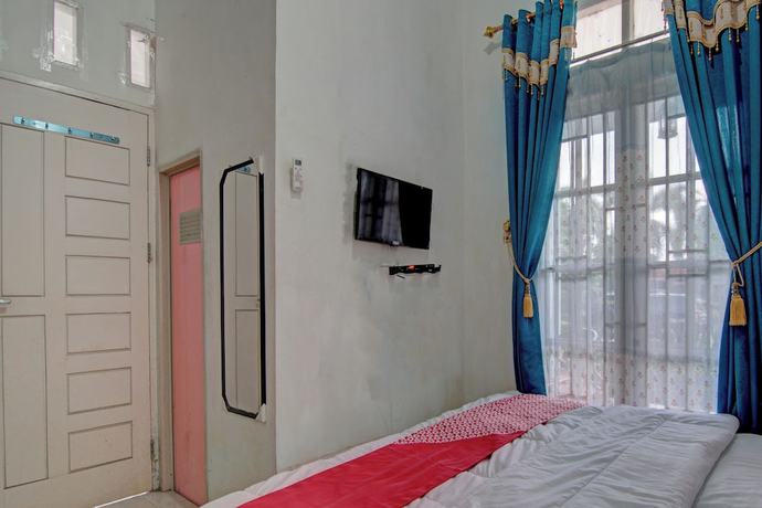 Imagen de la habitación del Hotel OYO 92818 Penginapan Garuda Syariah. Foto 10
