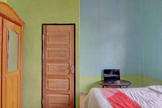 Imagen de la habitación del Hotel OYO 92818 Penginapan Garuda Syariah. Foto 11