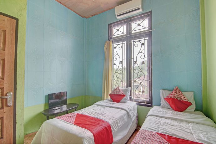 Imagen de la habitación del Hotel OYO 92818 Penginapan Garuda Syariah. Foto 12