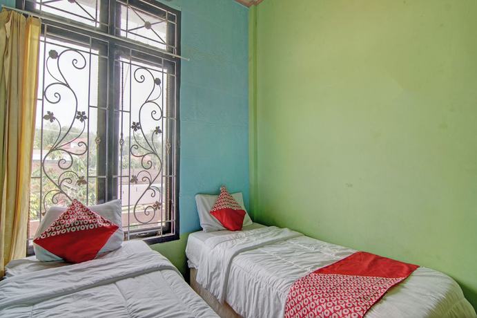 Imagen de la habitación del Hotel OYO 92818 Penginapan Garuda Syariah. Foto 17