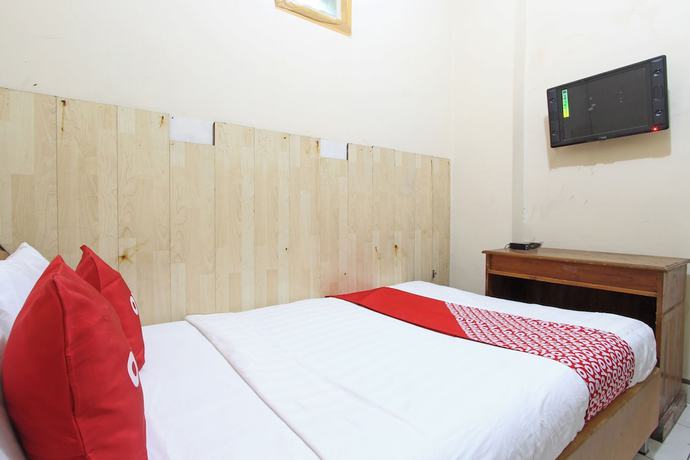 Imagen de la habitación del Hotel OYO 92821 Wisma Zahira 2 Syariah. Foto 4