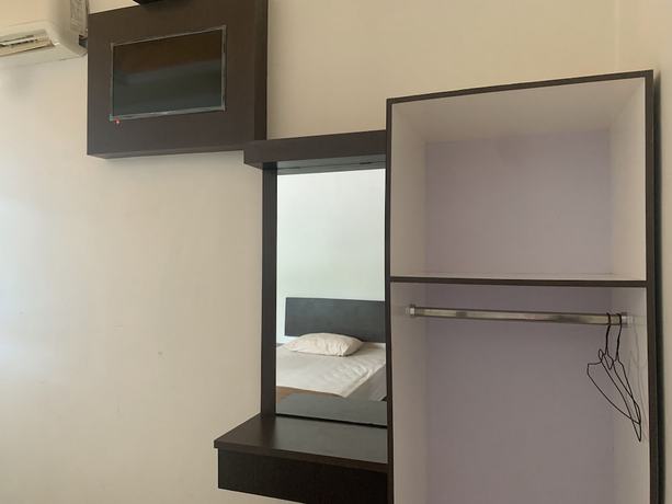 Imagen de la habitación del Hotel OYO 92899 Penginapan Laota Syariah. Foto 8