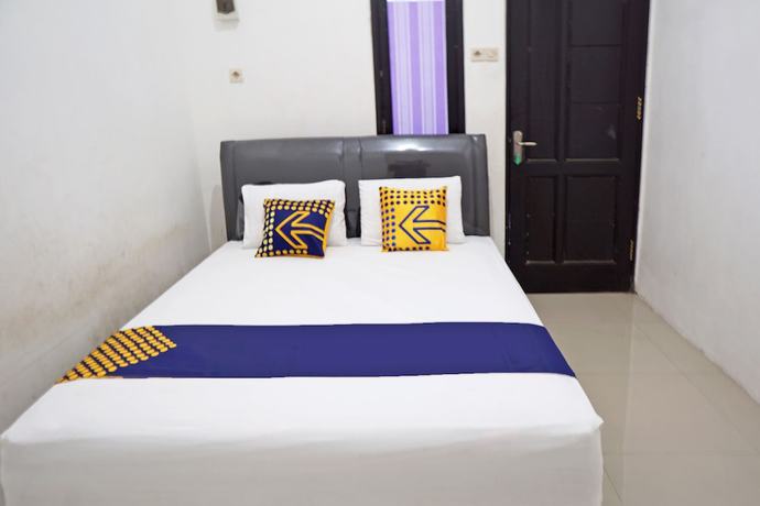 Imagen de la habitación del Hotel OYO 92938 Kost Putih Syariah. Foto 13