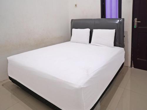 Imagen de la habitación del Hotel OYO 92938 Kost Putih Syariah. Foto 20
