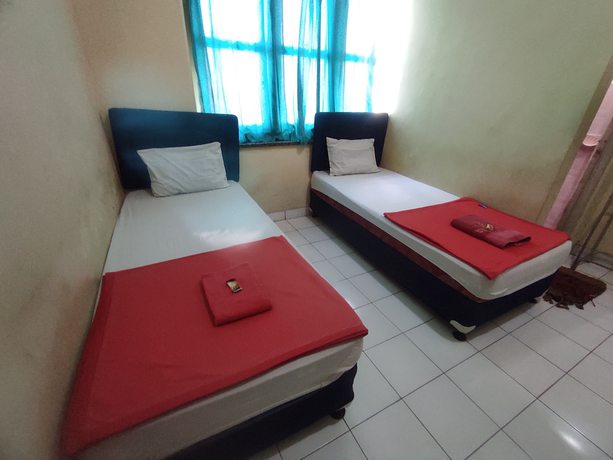 Imagen de la habitación del Hotel OYO 93048 Puri Mandiri. Foto 3