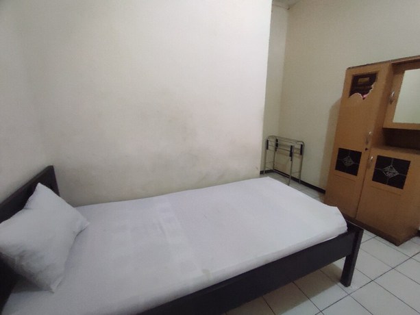 Imagen de la habitación del Hotel OYO 93048 Puri Mandiri. Foto 5