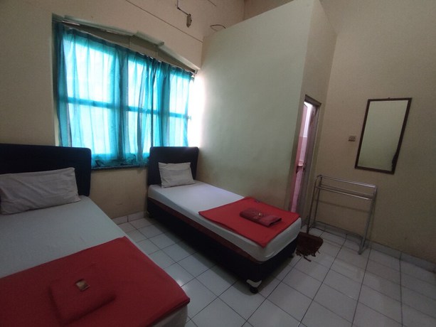 Imagen de la habitación del Hotel OYO 93048 Puri Mandiri. Foto 6