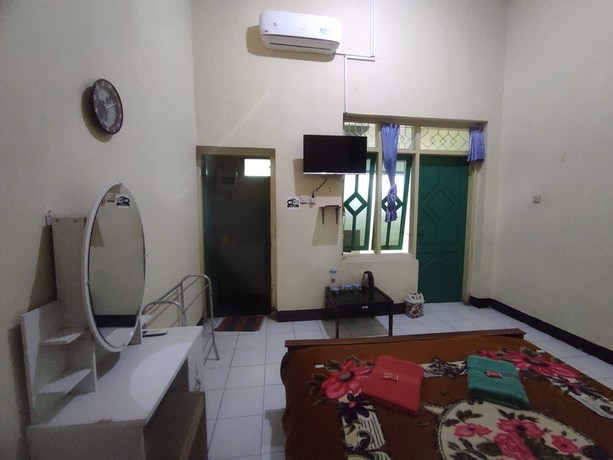 Imagen de la habitación del Hotel OYO 93048 Puri Mandiri. Foto 7