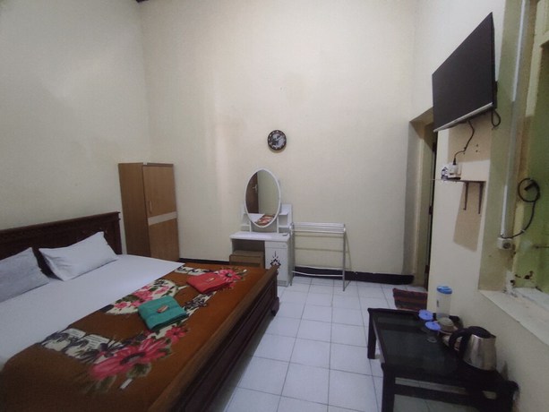 Imagen de la habitación del Hotel OYO 93048 Puri Mandiri. Foto 8