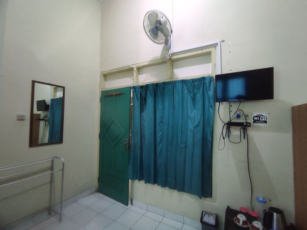 Imagen de la habitación del Hotel OYO 93048 Puri Mandiri. Foto 10