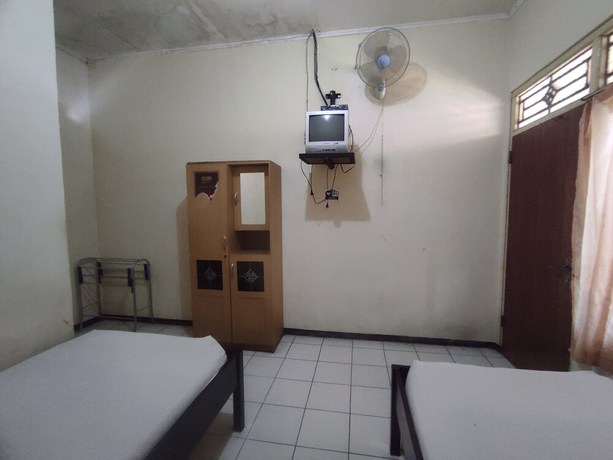 Imagen de la habitación del Hotel OYO 93048 Puri Mandiri. Foto 11