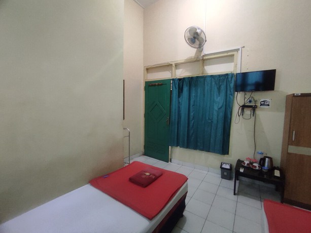 Imagen de la habitación del Hotel OYO 93048 Puri Mandiri. Foto 12