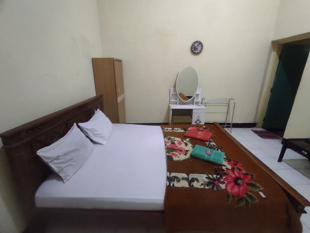 Imagen de la habitación del Hotel OYO 93048 Puri Mandiri. Foto 13