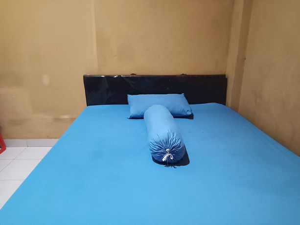 Imagen de la habitación del Hotel OYO 93073 Penginapan 69. Foto 2