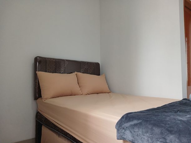Imagen de la habitación del Hotel OYO 93085 Homy Stay Syariah. Foto 2