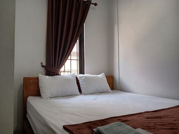 Imagen de la habitación del Hotel OYO 93085 Homy Stay Syariah. Foto 5