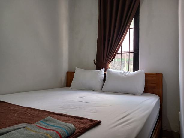 Imagen de la habitación del Hotel OYO 93085 Homy Stay Syariah. Foto 7