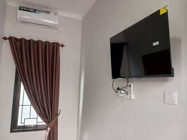 Imagen de la habitación del Hotel OYO 93085 Homy Stay Syariah. Foto 8
