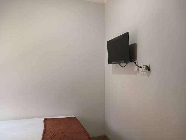 Imagen de la habitación del Hotel OYO 93085 Homy Stay Syariah. Foto 10