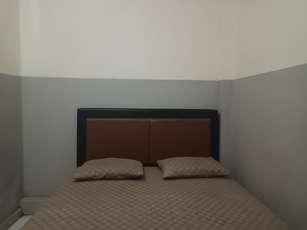 Imagen de la habitación del Hotel OYO 93090 Multi Plus Inn. Foto 3