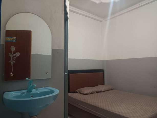 Imagen de la habitación del Hotel OYO 93090 Multi Plus Inn. Foto 4