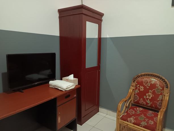 Imagen de la habitación del Hotel OYO 93117 Penginapan Tiga Dara. Foto 7