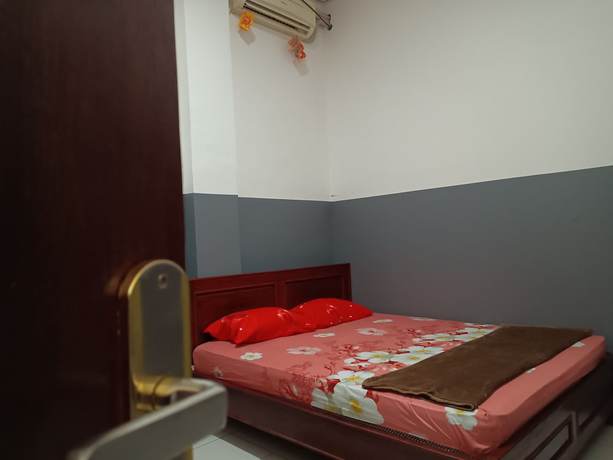Imagen de la habitación del Hotel OYO 93117 Penginapan Tiga Dara. Foto 12