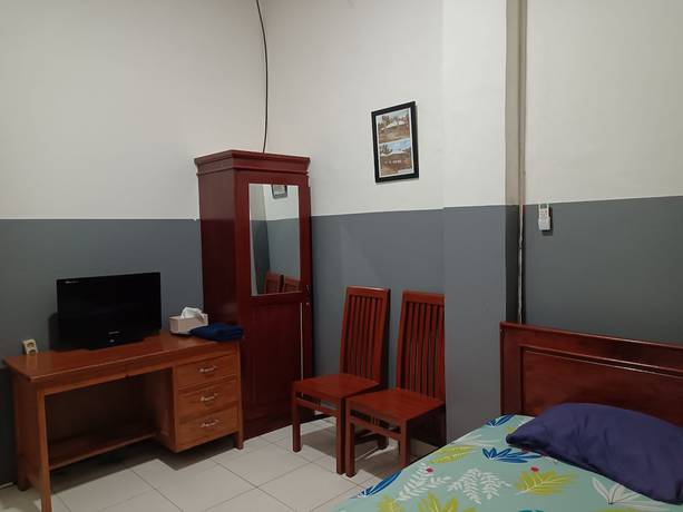 Imagen de la habitación del Hotel OYO 93117 Penginapan Tiga Dara. Foto 14