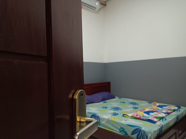 Imagen de la habitación del Hotel OYO 93117 Penginapan Tiga Dara. Foto 15