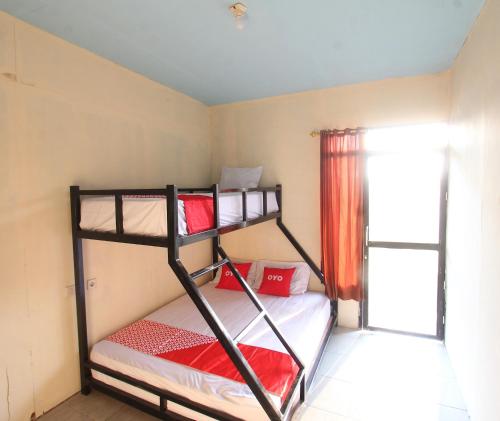 Imagen de la habitación del Hotel OYO 93121 Abi Bungalow & Hostel. Foto 19