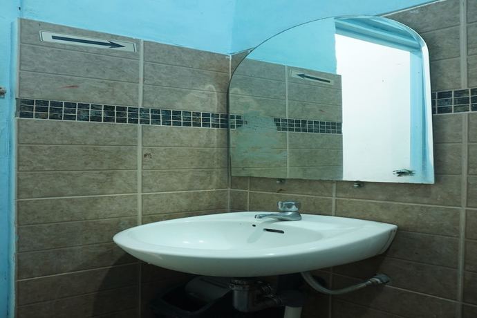 Imagen de la habitación del Hotel OYO 93122 Pondok Puti Sartika Syariah. Foto 3