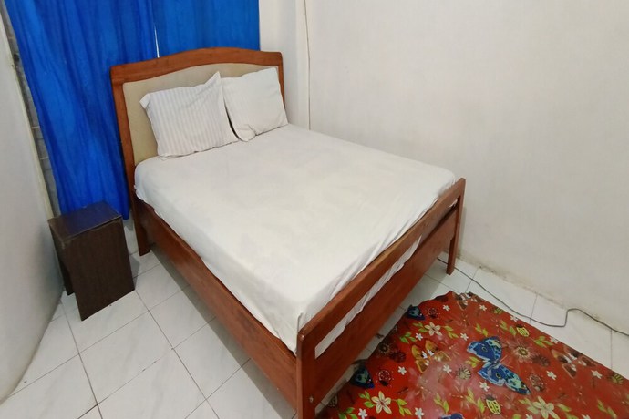 Imagen de la habitación del Hotel OYO 93122 Pondok Puti Sartika Syariah. Foto 4