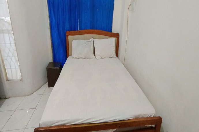 Imagen de la habitación del Hotel OYO 93122 Pondok Puti Sartika Syariah. Foto 7